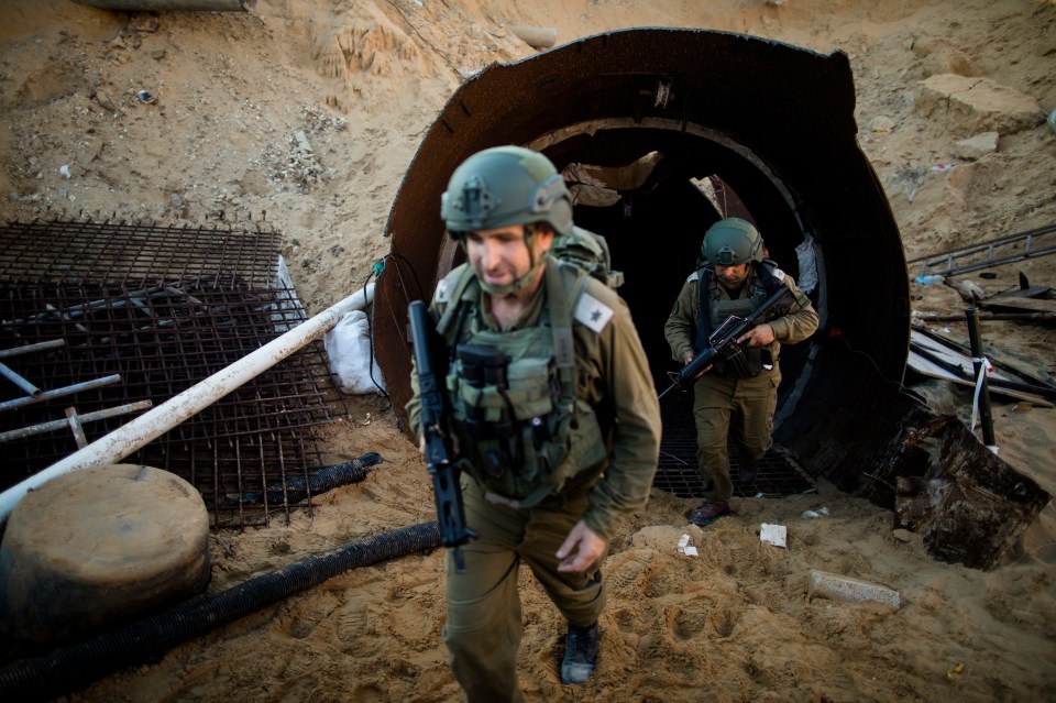 Israeli soldiers exit one of Hamas’ tunnel near the border with Israel on December 15