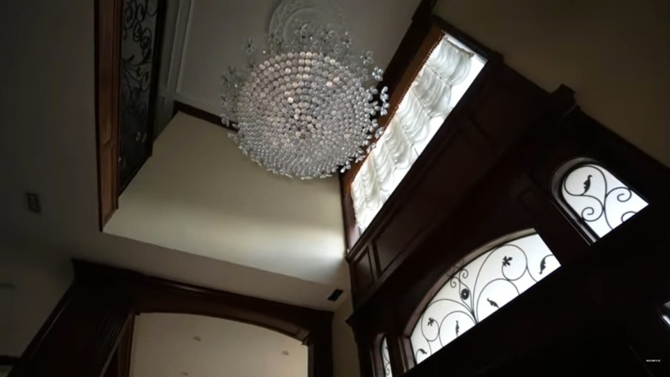 An impressive chandelier hung above the entrance