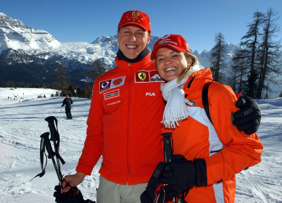 Michael Schumacher poses with his wife Corinna on a piste in 2003