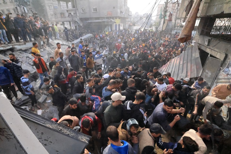 Palestinians search for survivors under rubble after an Israeli air strike