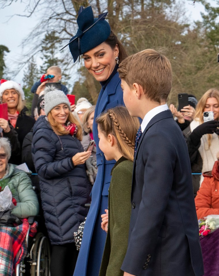 Kate smiling to her children