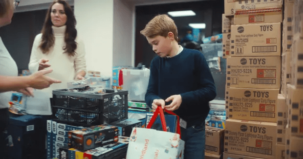 Prince George helped staff sort through toy during his baby bank visit