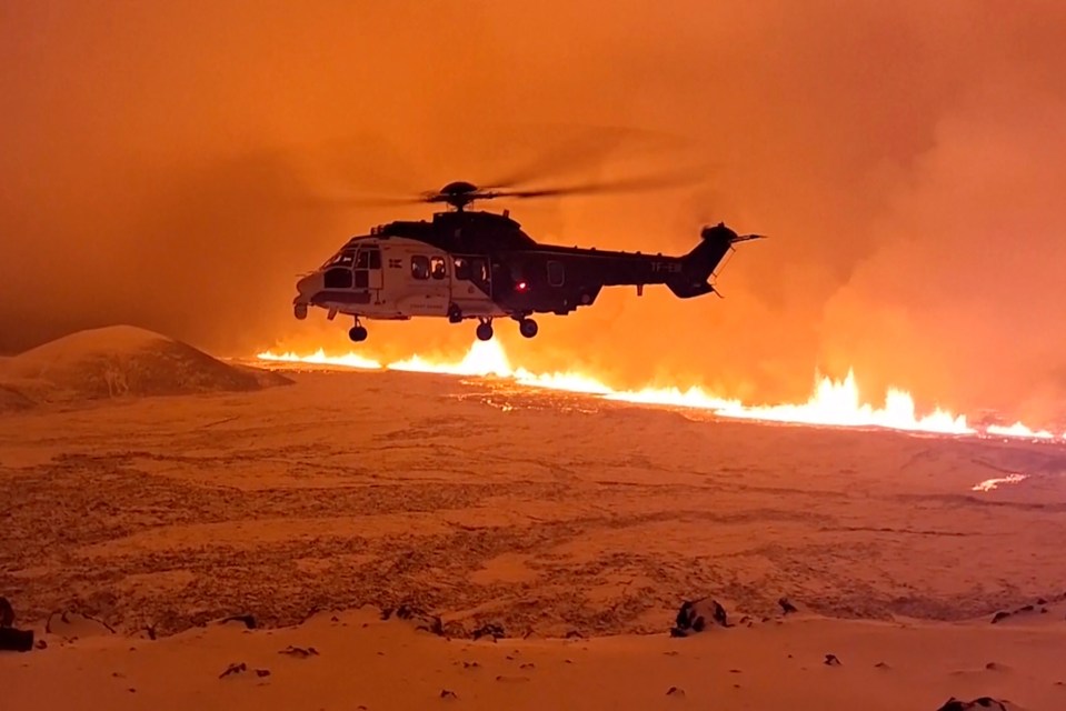 Icelandic Coast Guard helicopter flying over the lava near Grindavik on Monday