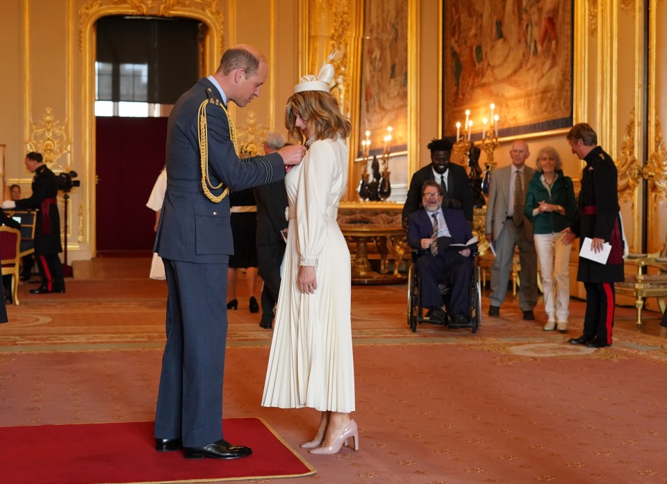 Kate was presented with a MBE by Prince William earlier this year with Derek watching on