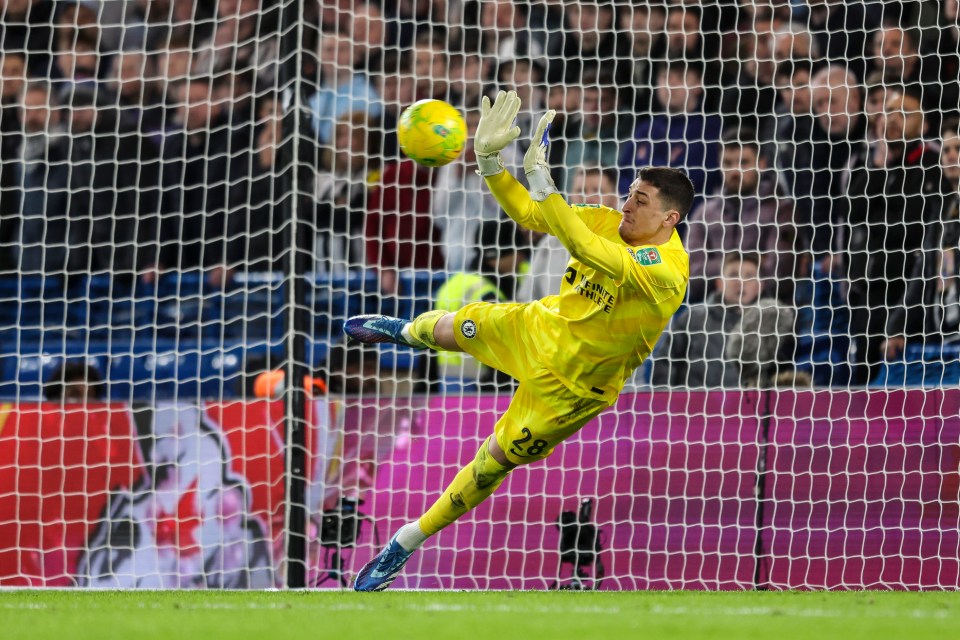 Djordje Petrovic produced a flying save to send Chelsea into the semis