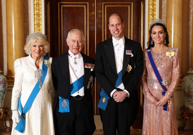 Queen Camilla, King Charles III, Prince William, Prince of Wales and Catherine, Princess of Wales pose for a photo at a white party event at Buckingham Palace