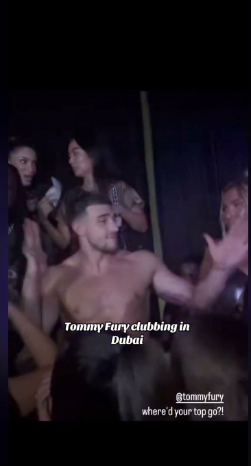 Tommy Fury shirtless at a nightclub in Dubai.