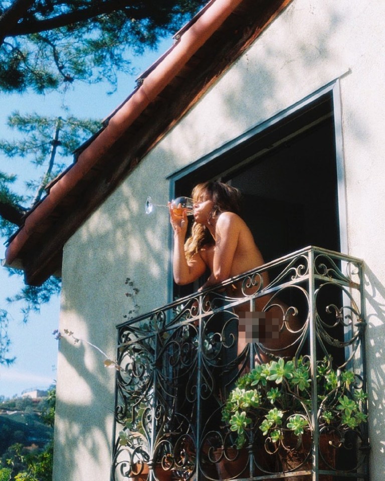 Halle Berry enjoyed a glass of wine whilst standing naked on her balcony