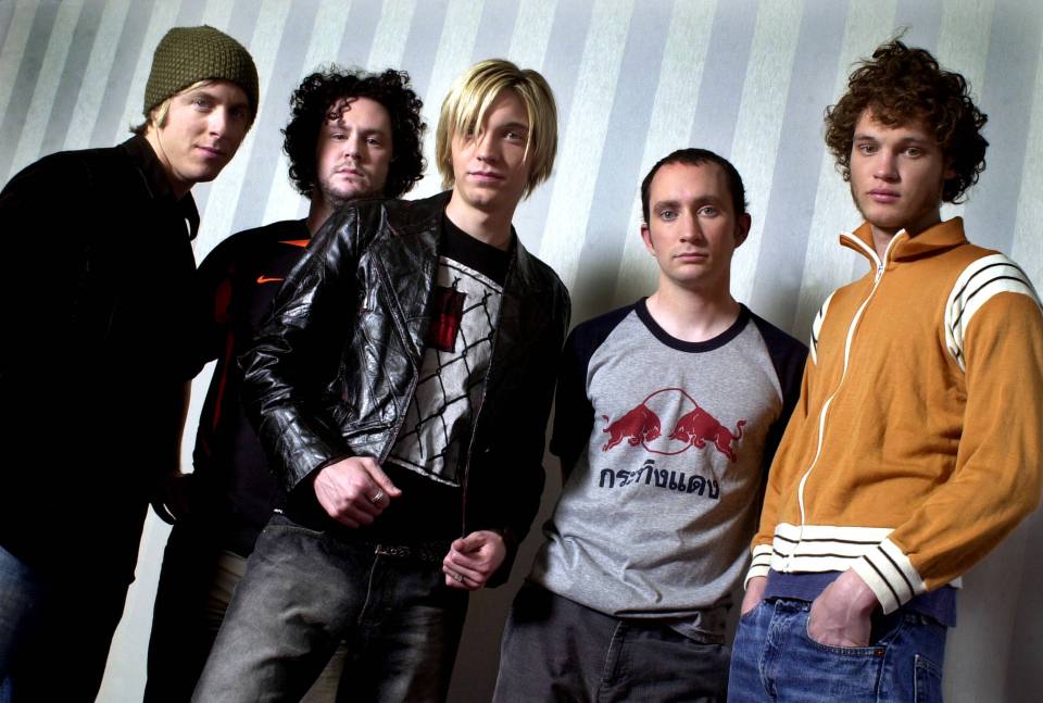 Alex became embroiled in a lawsuit with ex member Aaron Kamin, second left, over trademark rights over the band