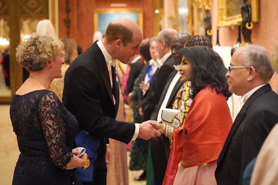 Prince William warmly greeting others at the event