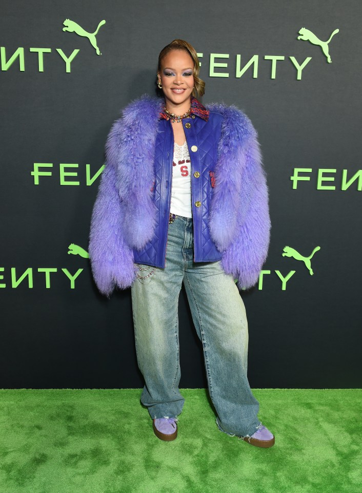 Rihanna wore this eclectic outfit that included a purple faux fur jacket, baggy jeans and a chunky necklace