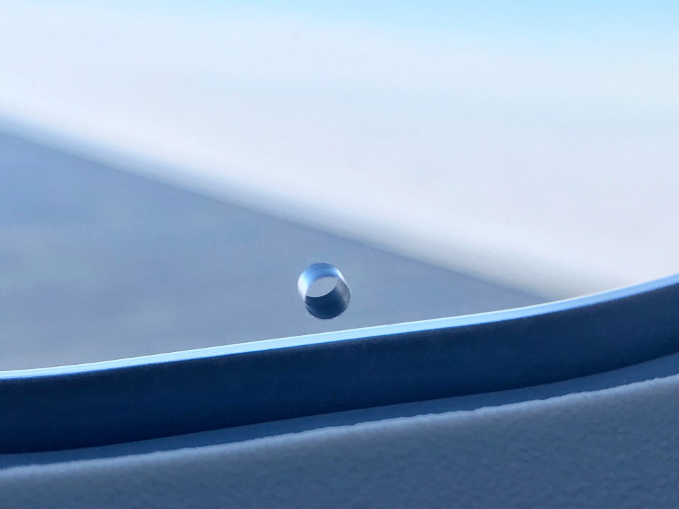 Plane windows have small holes in them - but you don't need to worry