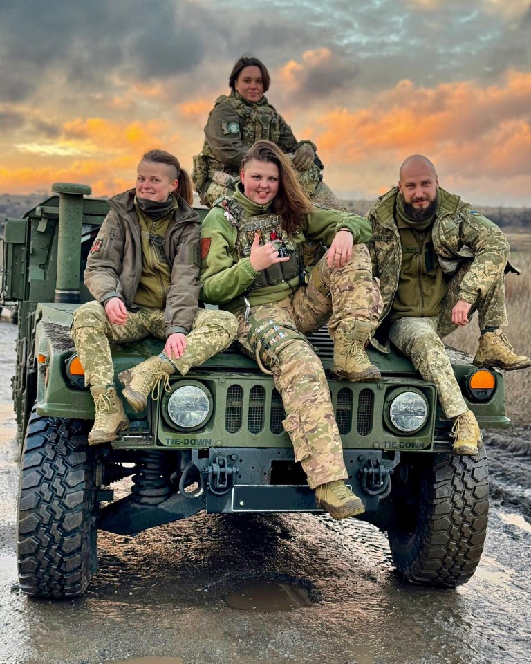 The brave combat medic, pictured with her comrades, said she will always have the strength to carry on in the defence of Ukraine