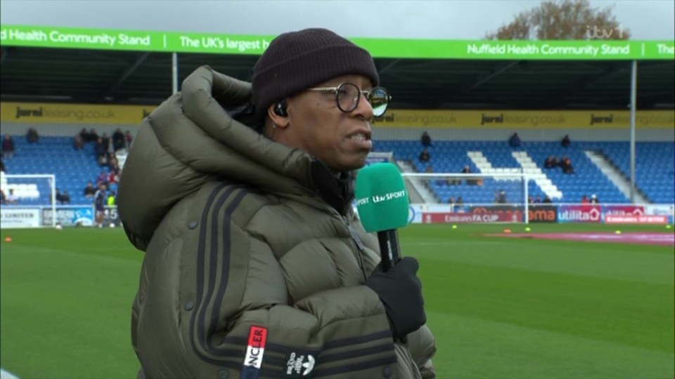 Ian Wright made sure he kept warm on the touchline