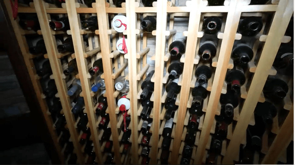 The property has a wine cellar with hundreds of bottles of wine