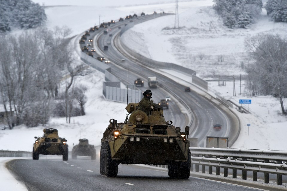 A convoy of Russian armoured vehicles moves along a highway in Crimea in 2022