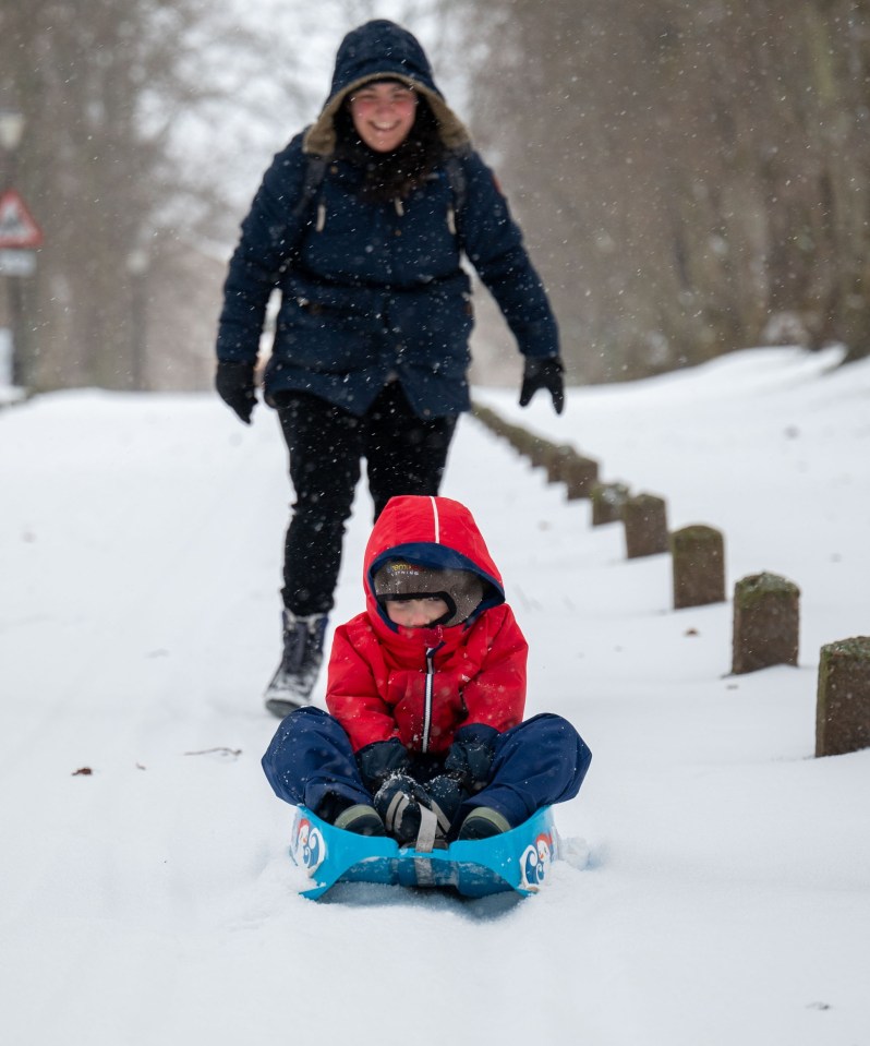 Bethany Austin and her son Ambrose 4 playing in the snow in Huntly Aberdeenshire