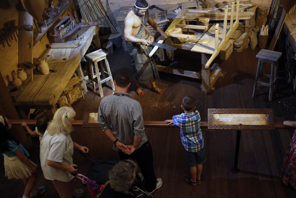 A family view an exhibit inside the Noah’s Ark replica