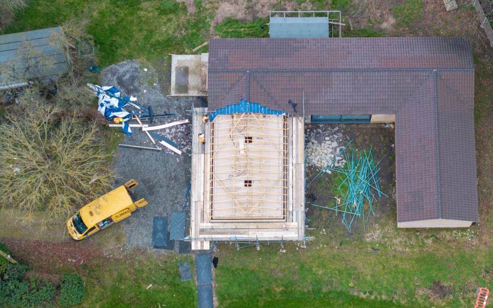 Workmen today ripped off the roof of a spa building belonging to Captain Tom's daughter