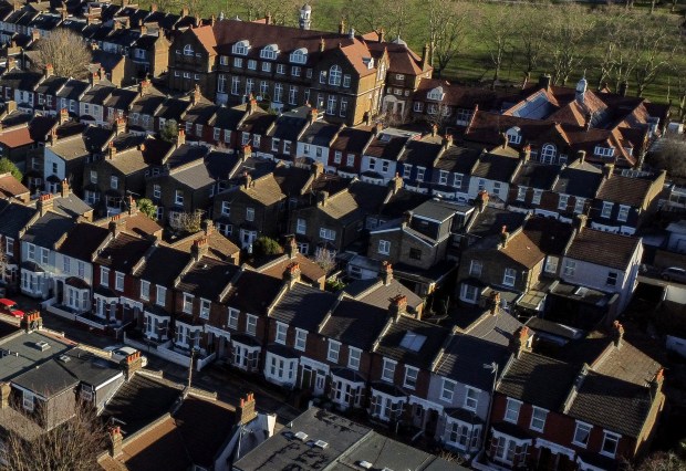 an aerial view of a row of houses in a residential area