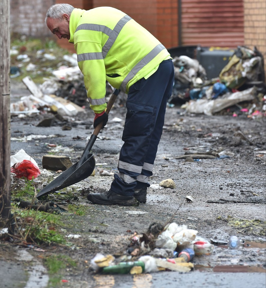 A council worker clearing rubbish