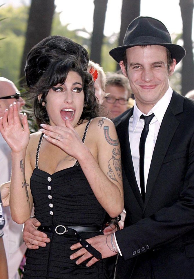 File photo dated 03/06/07 of Amy Winehouse and ex-husband Blake Fielder-Civil, who recently claimed they have been in contact and he wants them to get back together. PRESS ASSOCIATION Photo. Issue date: Tuesday August 25, 2009. Winehouse was granted a 'quickie' divorce last month on the grounds of her adultery. See PA story SHOWBIZ Winehouse. Photo credit should read: Yui Mok/PA Wire