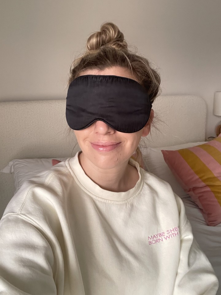 Woman wearing a sleep mask.