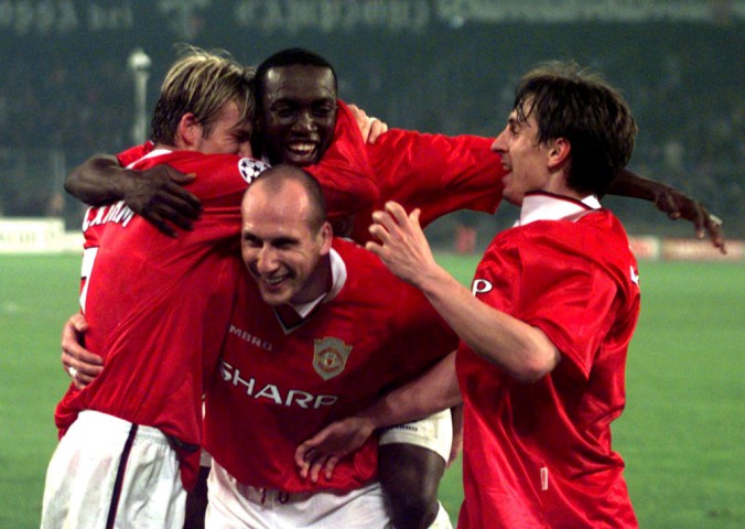 TUR34D:SPORT-SOCCER-CUP:TURIN,ITALY,21APR99 - Manchester United players Dwight Yorke (C), David Beckham (L) Jaap Stam (bottom) and Gary Neville celebrate their victory in the European Cup semi-final match against Juventus in Turin April 21. Manchester United won 3-2. ph/DIGITAL/Photo by Gianluca Venturelli REUTERS