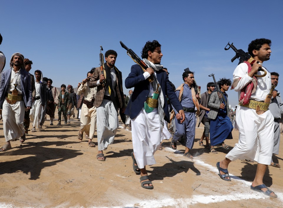 Armed Houthi followers march in support of Houthi strikes on ships in the Red Sea and the Gulf of Aden