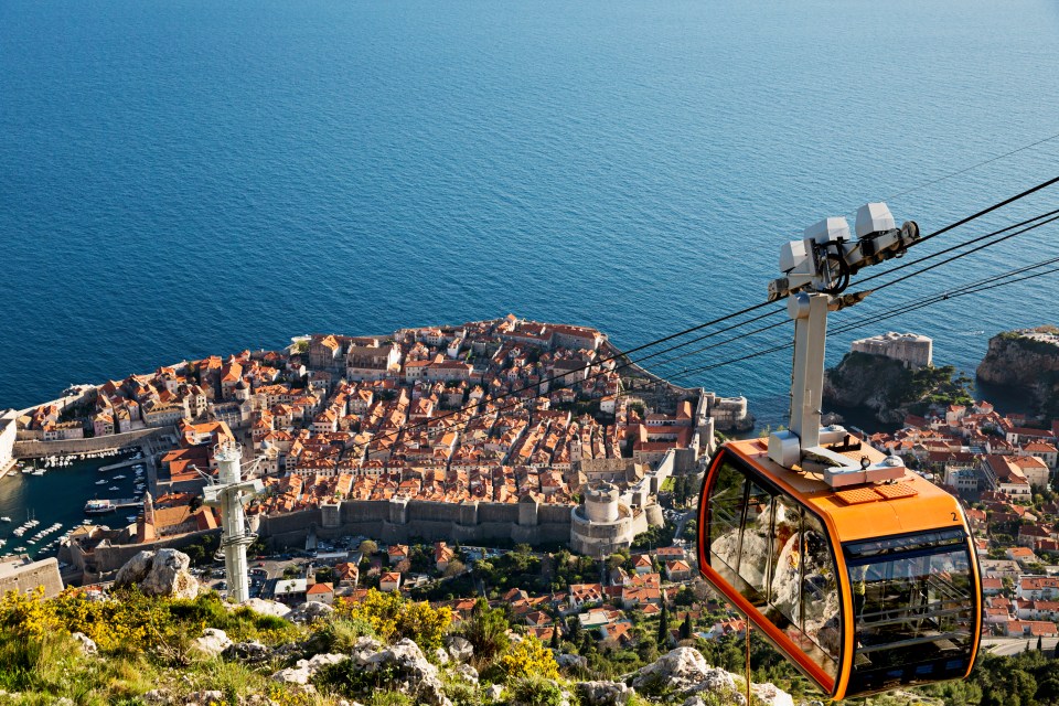 Take the cable car up Mount Srd, which rises nearly 1,400ft above the old town