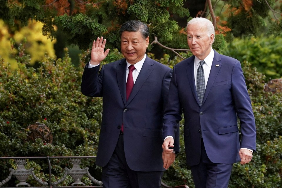 President Xi walking with President Biden in California in November as the two leaders tried to deescalate tensions between their countries