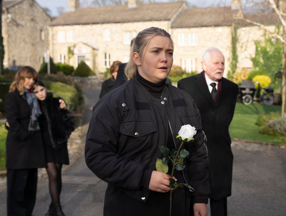 Cathy waves a final goodbye to her later twin brother Heath this week