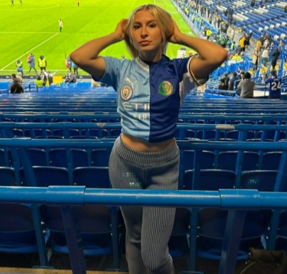 She angered Chelsea fans after posing in a half-and-half shirt at their clash with Manchester City