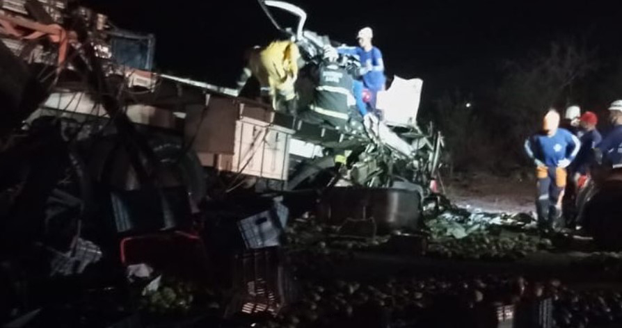 Emergency responders are pictured trying to pull survivors from the wreckage