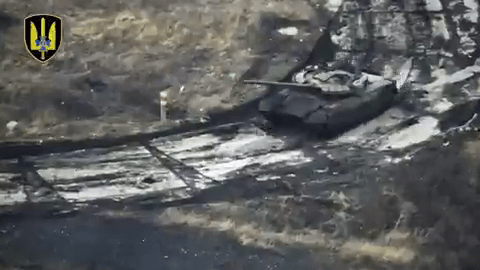 The T-80BVM tank ploughs through the frozen mud close to Ukraine's eastern frontline