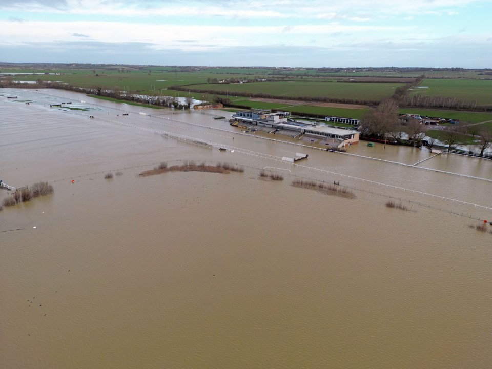 The devastating scene at Huntingdon racecourse – where somewhere a track lies deep beneath the muddy water