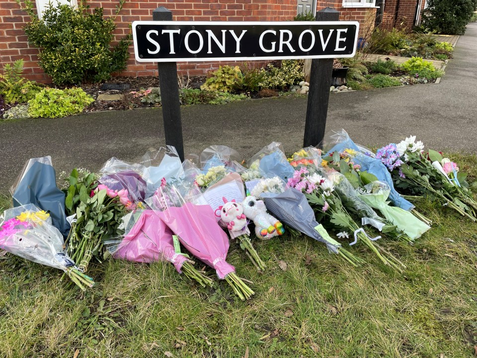 Floral tributes have piled up left near the house after the tragedy