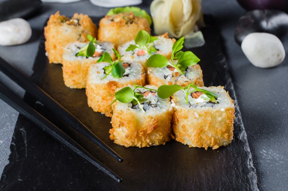 Fried tempura sushi rolls with salmon and cheese could be adding extra fat into your diet