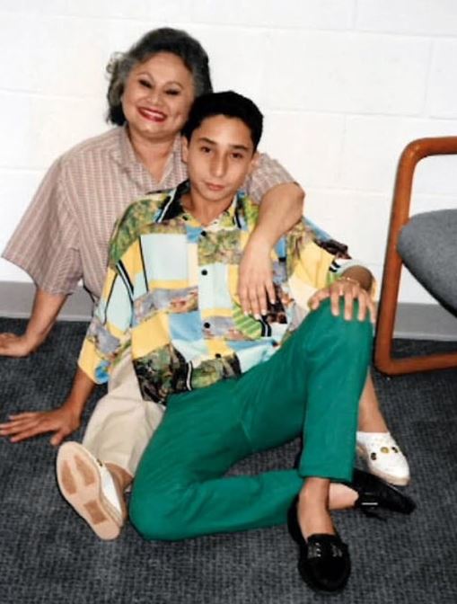 Michael pictured with his mother before her time in prison