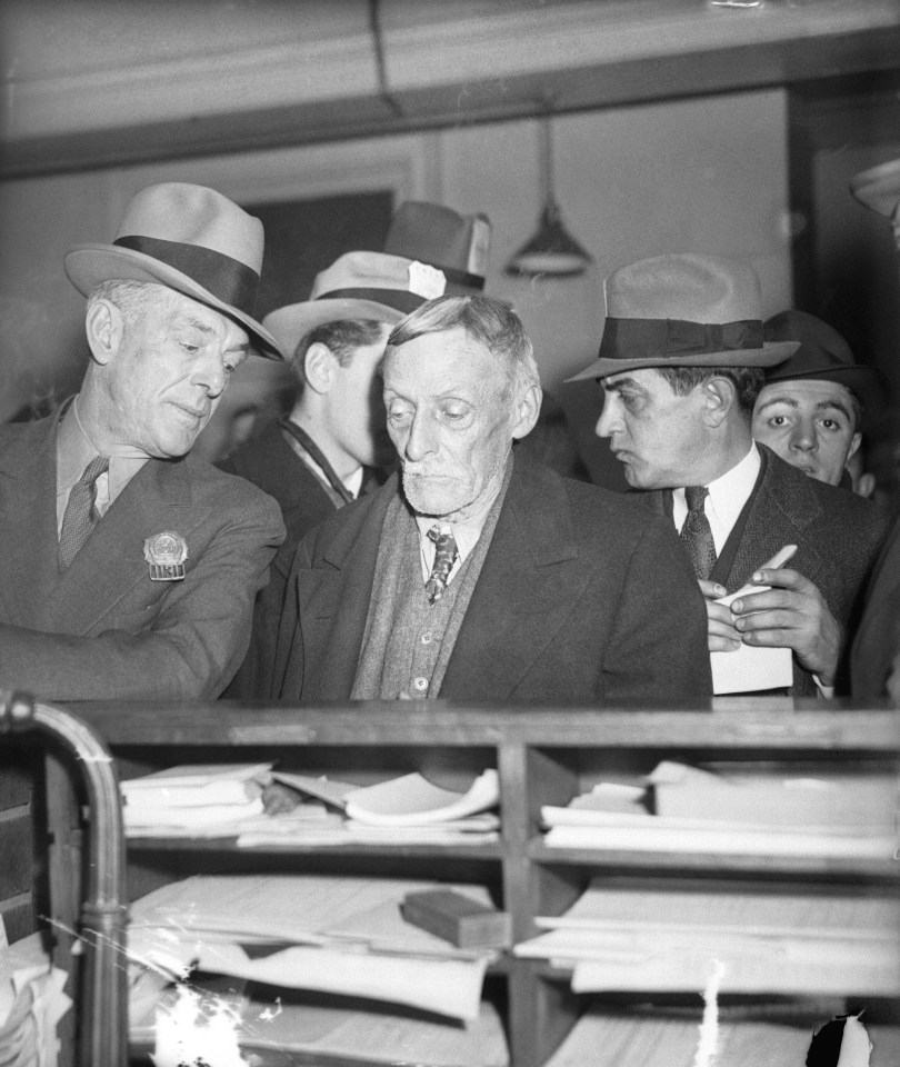 Fish being led into court by detective William King, who captured him after a six year search