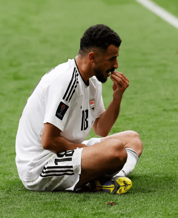 Aymen Hussein celebrated his goal by eating grass