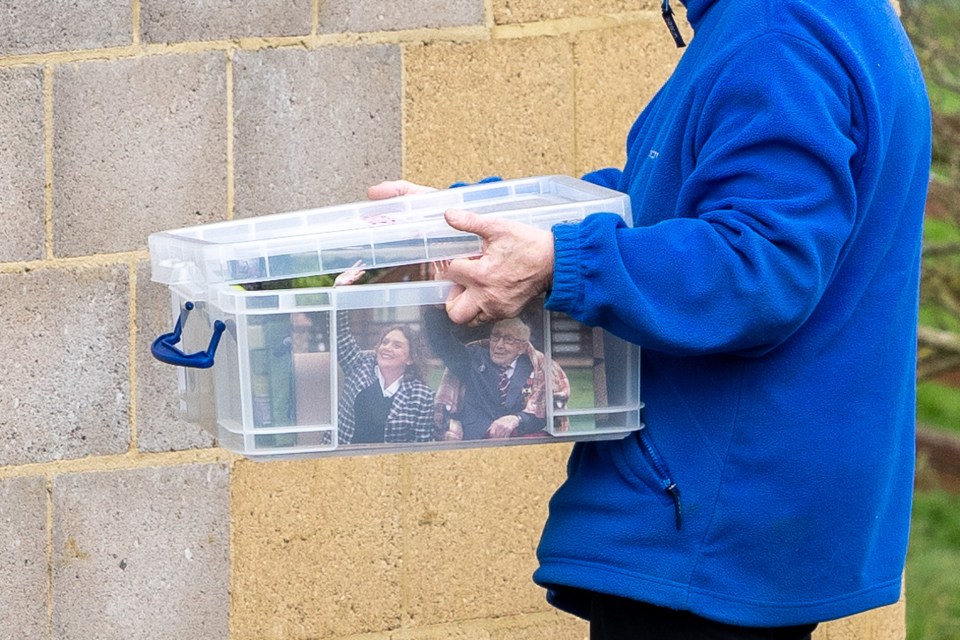 Boxes of pictures were seen being carried out