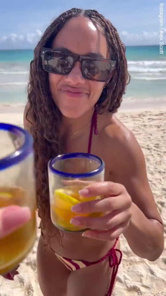 The couple said cheers on a beach over Christmas