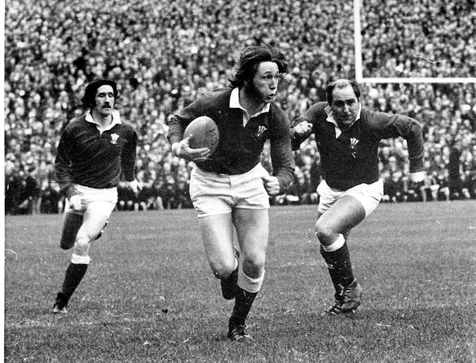 Williams supported by fellow Wales teammates Gerald Davies and Jeff Young in 1971