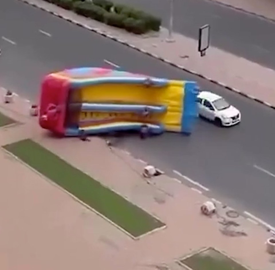 The bouncy castle was swept through the busy road