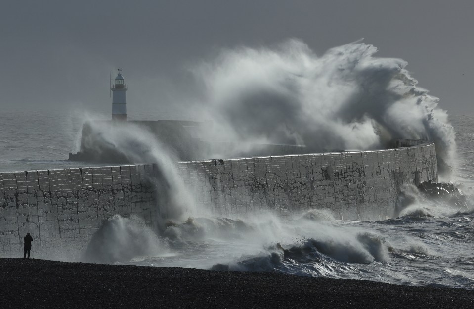 Large waves hit the seawall and harbour during Storm Isha, at Newhaven on January 22