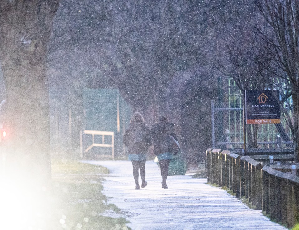 Commuters in Scarborough, Yorkshire, battled the snow and freezing temperatures on their way to work