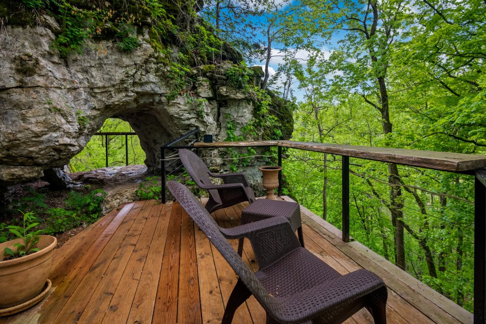 From outside, the cave has a porch, sitting area and front door, just like any other house