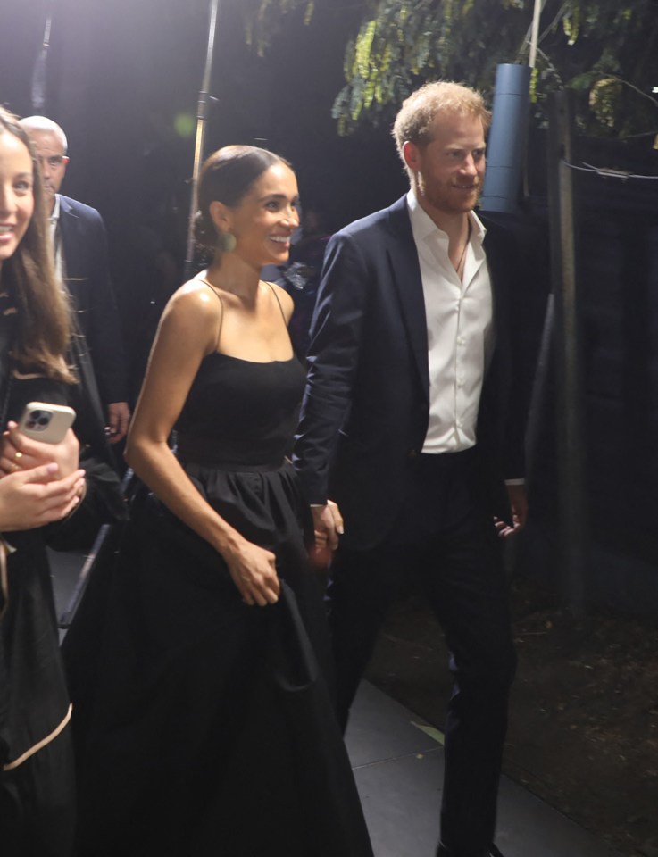 While Meghan appeared 'gracious and charming', Harry on the other hand seemed 'awkward and distracted'