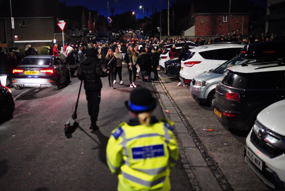 A policewoman watches over the vigil